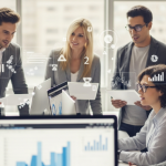 Professionals collaborating in a modern office, surrounded by abstract representations of data visualizations and reports.